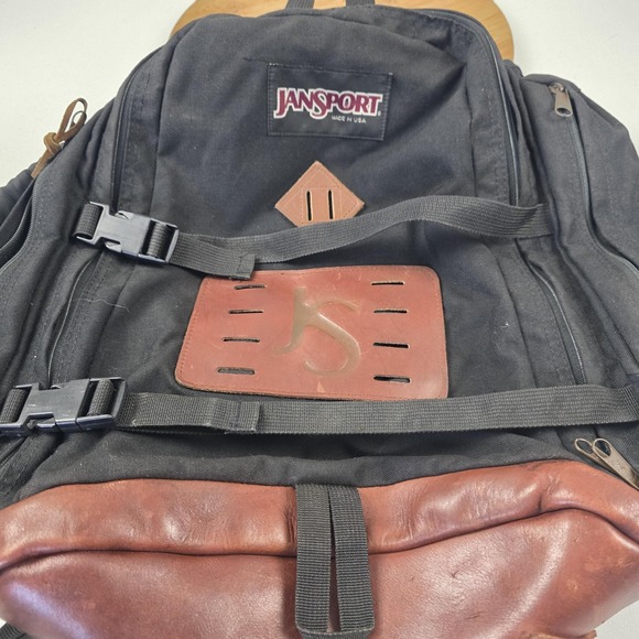 black backpack with brown leather bottom JanSport Pitstop Daypack Duffle Bag Carry On Leather Backpack |